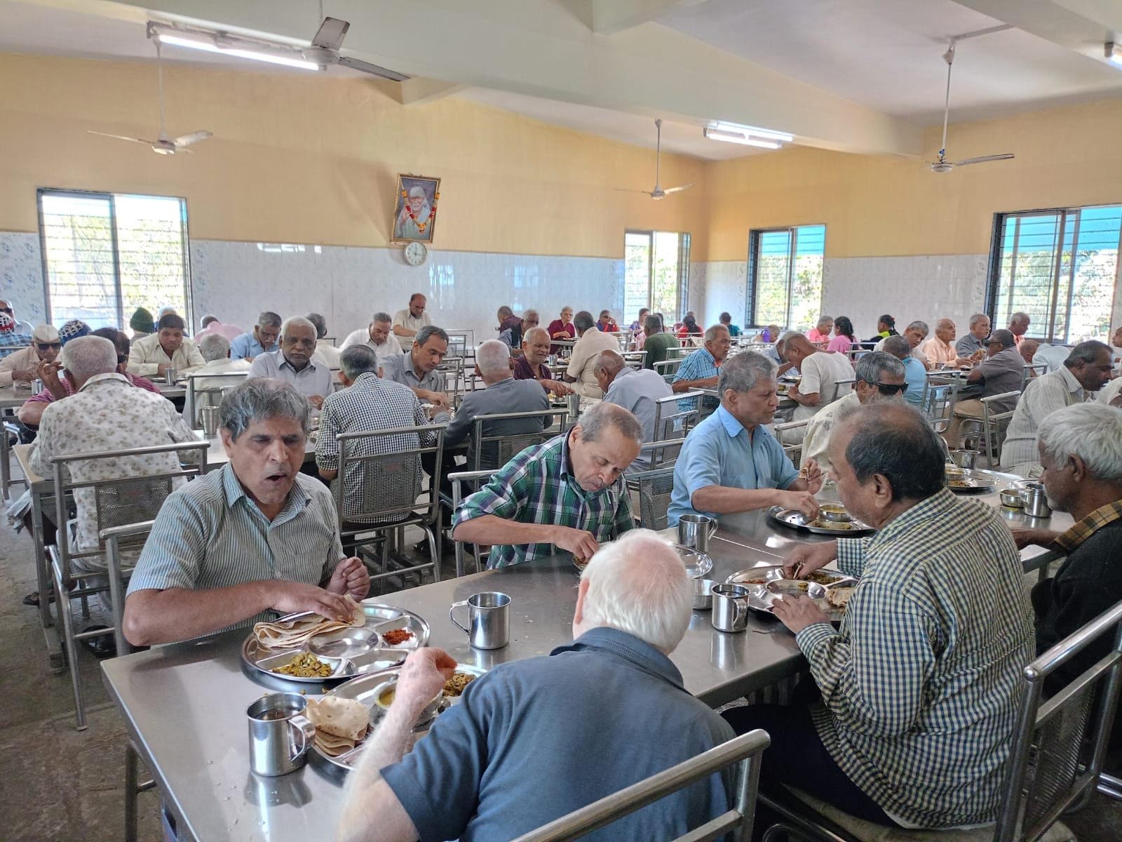 A picture of the canteen where several residents are having their lunch