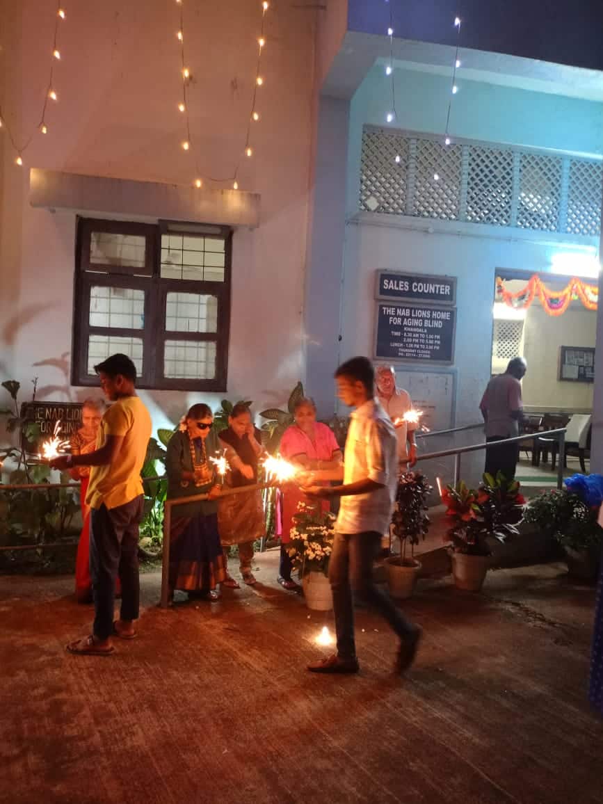 A group of residents celebrating the festival of Diwali