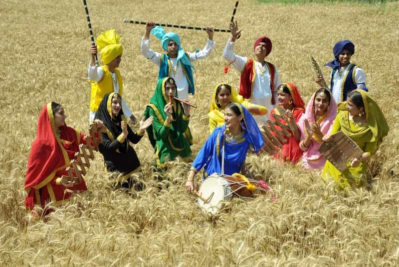 A group of performers (not residents) dressed up in traditional attire, and celebrating the festival of Baisakhi